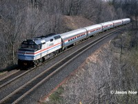On a spring morning, Amtrak #97 with F40PH 243 is seen approaching Bayview Junction on the CN Oakville Subdivision as it heads to Niagara Falls and eventually the U.S.