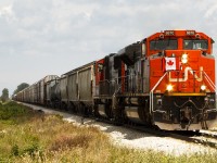 <b>HAPPY CANADA DAY!</b> The unusual movement of CN 439 in daylight was led by celebratory, flag mounted CN 8870. 