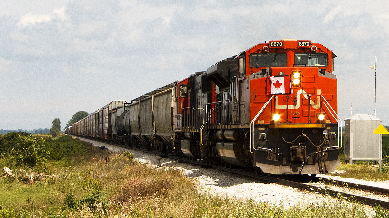 HAPPY CANADA DAY! The unusual movement of CN 439 in daylight was led by celebratory, flag mounted CN 8870.