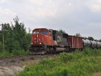CN SD75i 5709 is the sole power on a westbound empty ethanol train as it approaches Bodson Drive in Hanmer, Ontario on June 29, 2014.