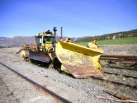 <b> Feeling and looking a little out of place </b> <br>
On a clear and warm April 18, 2025 morning, snow gear equipped CN 612-50 a Kershaw Mfg. 46-6-1 combination ballast regulator/snow fighter, serial number C46-420-98, built in 1998, sits parked on a dead-end back track at Westwold, BC Mile 37.8 CN Okanagan Sub. on April 18, 2025. <br>
This Work Equipment machine was built new at the Kershaw Mfg. plant in Cornwall, ON in 1998.