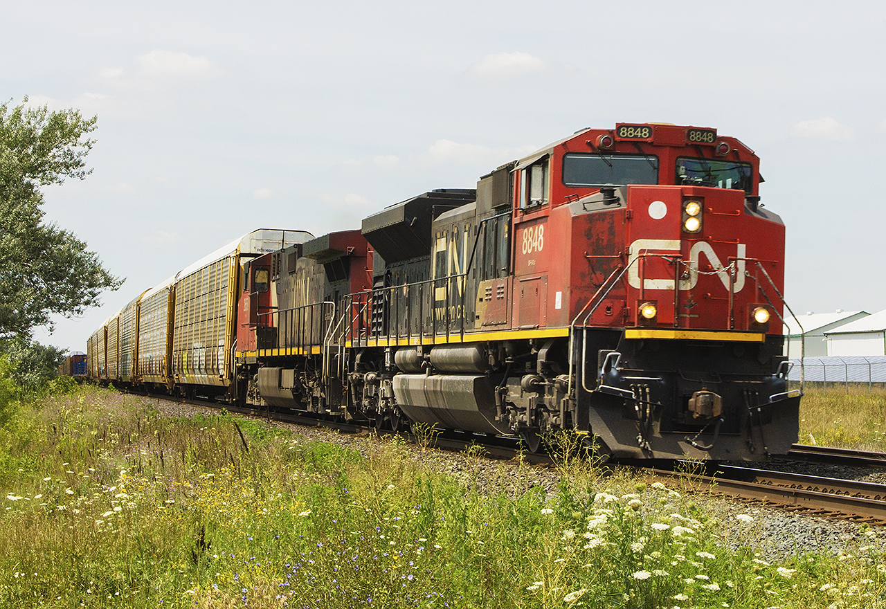 There isn't a lot to see in this small farming community. However, trains have been passing through for a very long time. There once was a small station, that would have stood to the left, by the overhanging tree. 


Here, passing the old station site, CN 8848 and another unit that I didn't record the number of...start to lean into the curve as they rumble eastward with their mixed freight.