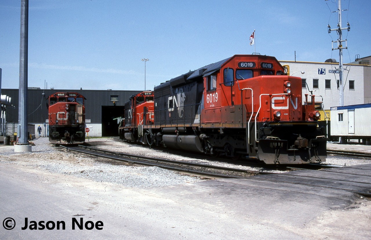 CN SD40u 6019 and GP40-2L(W) 9531 as well as GP40-2L(W) 9546 are viewed outside the MacMillan Yard diesel shop in Vaughan, Ontario. Over three decades later, and SD40u 6019 is now assigned to hump service at the same yard along with several other 6000-series SD40u's.