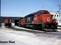 CN SD40u 6019 and GP40-2L(W) 9531 as well as GP40-2L(W) 9546 are viewed outside the MacMillan Yard diesel shop in Vaughan, Ontario. Over three decades later, and SD40u 6019 is now assigned to hump service at the same yard along with several other 6000-series SD40u's. 
