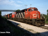 CN train 395 is viewed slowly rolling down the siding in Kitchener, Ontario to clear the mainline for VIA #89, which was due within the hour. Powering the Chicago-bound freight were SD40-2(W) 5336, SD75I 5629 and SD40-2(W) 5360. This was likely brand new 5629’s first trip down the line as it was released from the GMDD plant in London just over a week prior on June 2, 1996. Once the crew reached the yard, they would lift the loaded Budd automotive frame cars and await the arrival of 89 before proceeding west. In the meantime, the friendly conductor invited several local railfans up to tour the cab of fresh 5629 to get some photos. What great times they were. 