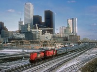 A pair of RS18 units leads a Tempo train west out of Toronto Union Station. 
