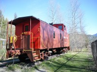 <b> Caged Caboose </b> <br>
CP 437336 steel sheathed caboose built in 1949 sits on static display behind the Frost fence next to the CP mainline at the 'Last Spike rest stop' in Craigellachie, BC on April 17, 2025.
