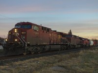 These were the days that I miss, having an hour or more before work. Here, in the early morning light, the city is awakened by the steady throttle of a westbound freight. I wish ex-SOO unit 6254 was leading, but still a nice catch.
