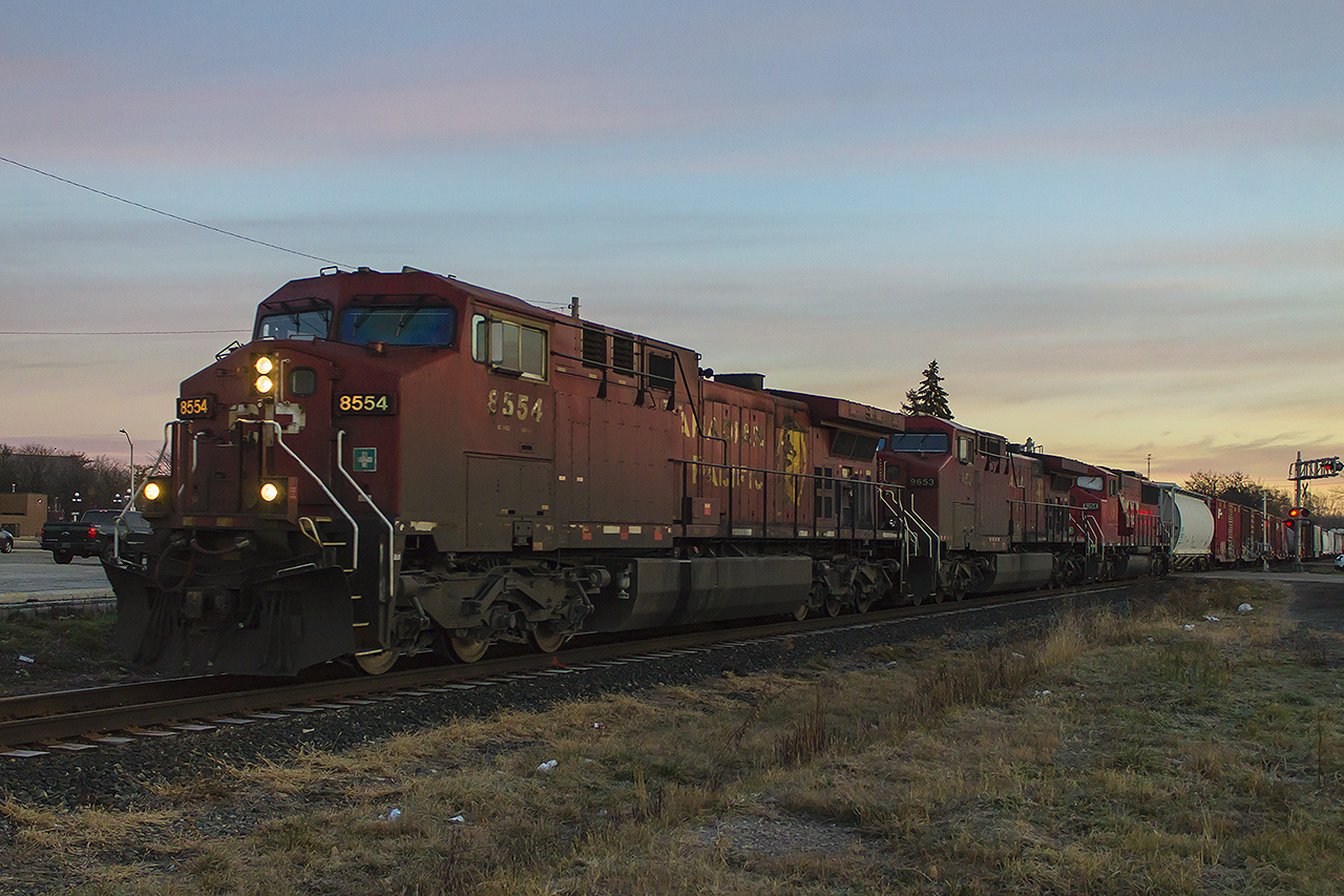 These were the days that I miss, having an hour or more before work. Here, in the early morning light, the city is awakened by the steady throttle of a westbound freight. I wish ex-SOO unit 6254 was leading, but still a nice catch.