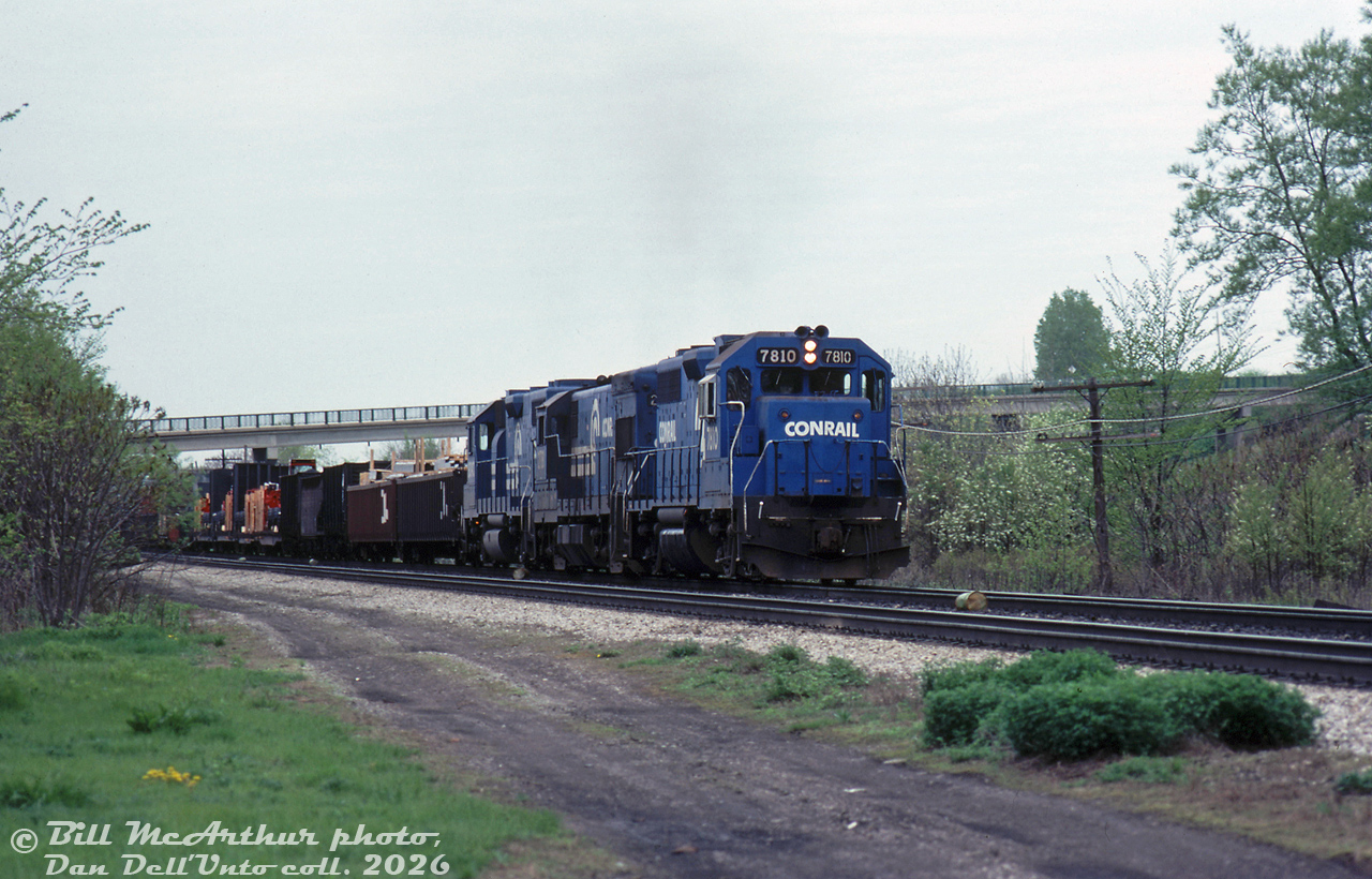 Some all-blue Conrail action on the CN Oakville Sub: CR GP38 7810, U23B 2781 and GP38-2 8090 roll an unknown eastbound through Aldershot. There appears to be some heavy equipment loaded on the head end flatcars, possibly Massey Ferguson farm equipment loads.Bill McArthur photo, Dan Dell'Unto collection slide.