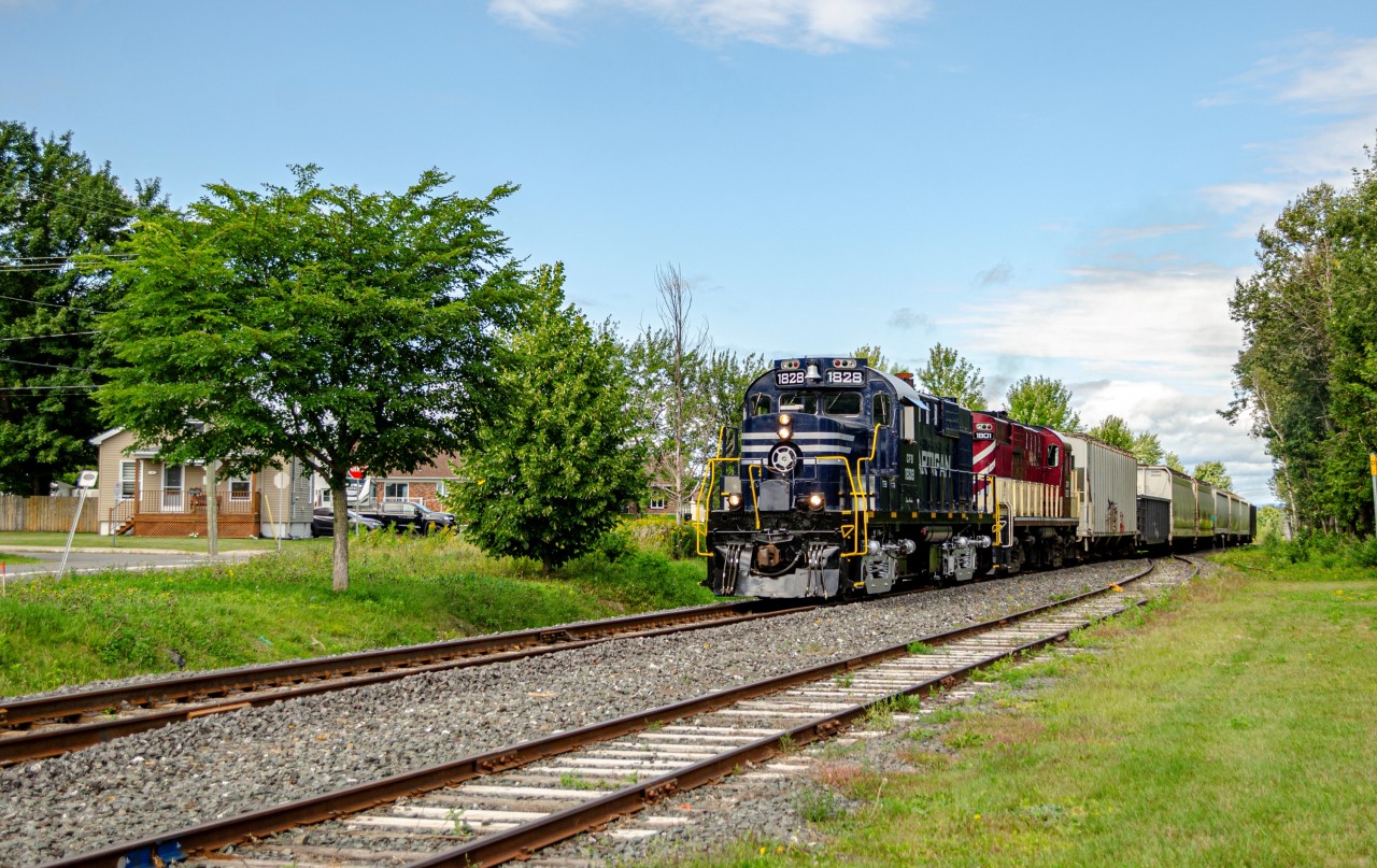 Sartigan's pair of ex-CP MLW RS18us lead the southbound train to Saint-Lambert-de-Lauzon, where they will park the engines for the night. One of the 2 RS18s, CFS 1801, was recently purchased from the Ontario Southland Railway, where it formerly was OSR 182. All the cars pulled by the locomotives were headed to the transload facilities in St-Lambert, hence why they didn't run all the way to Scott that day.