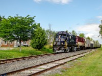Sartigan's pair of ex-CP MLW RS18us lead the southbound train to Saint-Lambert-de-Lauzon, where they will park the engines for the night. One of the 2 RS18s, CFS 1801, was recently purchased from the Ontario Southland Railway, where it formerly was OSR 182. All the cars pulled by the locomotives were headed to the transload facilities in St-Lambert, hence why they didn't run all the way to Scott that day.