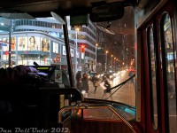 The experienced hand of the streetcar operator of TTC CLRV 4101 sits at the ready to rip off a paper transfer for any last-minute borders aboard this 505 Dundas streetcar, as we sit at the lights at the busy intersection of Dundas Street and Yonge Street waiting for the mad pedestrian traffic scramble to end. The 9pm traffic tonight is a little heavy along this stretch of Dundas by the Eaton Centre and Ryerson's Ted Rogers School of Management, and some March winter flurries still linger, but we're warm inside for the short ride across Dundas to University Avenue.