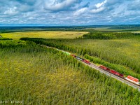 From up in the air, you get to appreciate how vast the geography of northwestern Ontario. West of Thunder Bay, somewhere between Upsala and English River is the siding location named Sheba. Lots of muskeg and mosquitos! From up in the air we see train 420 down for a meet with 119, flying by on the main.