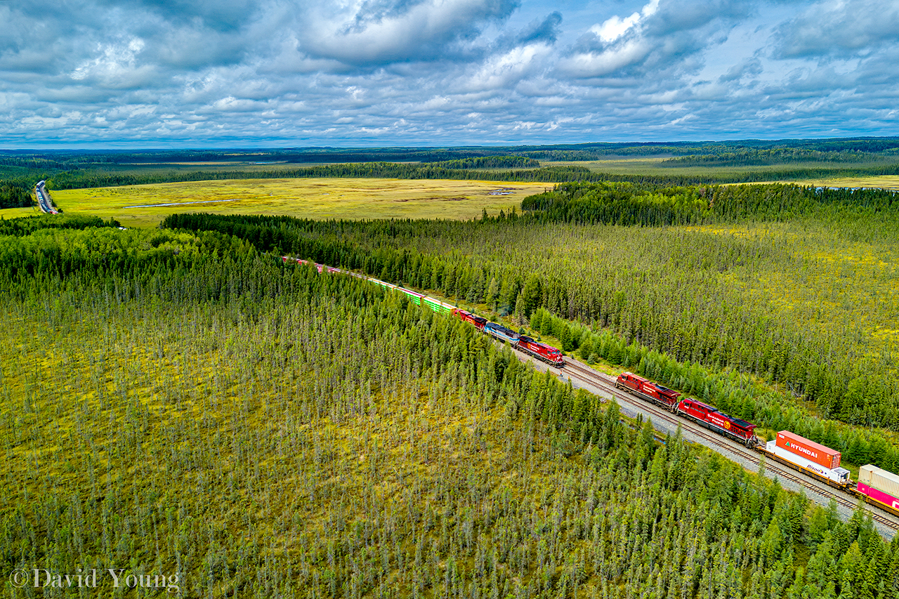 From up in the air, you get to appreciate how vast the geography of northwestern Ontario. West of Thunder Bay, somewhere between Upsala and English River is the siding location named Sheba. Lots of muskeg and mosquitos! From up in the air we see train 420 down for a meet with 119, flying by on the main.