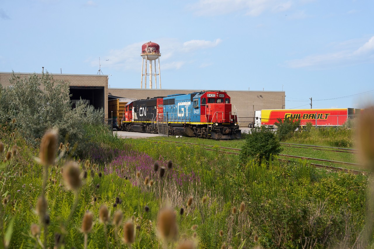 Trunked up. Toronto showed up for this one... Double GTW GP40-2's, one blue and the other CN North America, are seen on the head end of train L529, ready to depart for for MacMillan Yard after working Home Depot Lumber and XTL in the north end of Etobicoke.