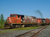 One of CN's more horrid looking GP38-2W leads as CN YRP003 backs up before heading towards Getpaq with three boxcars.