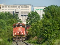 CN YRP003 is shoving boxcars into the last track still in use in what was once the Longue Pointe Yard, but is now a forest. They will leave the boxcars here while they spot inbound cars at a client (Getpaq) and then grab these cars afterwards.