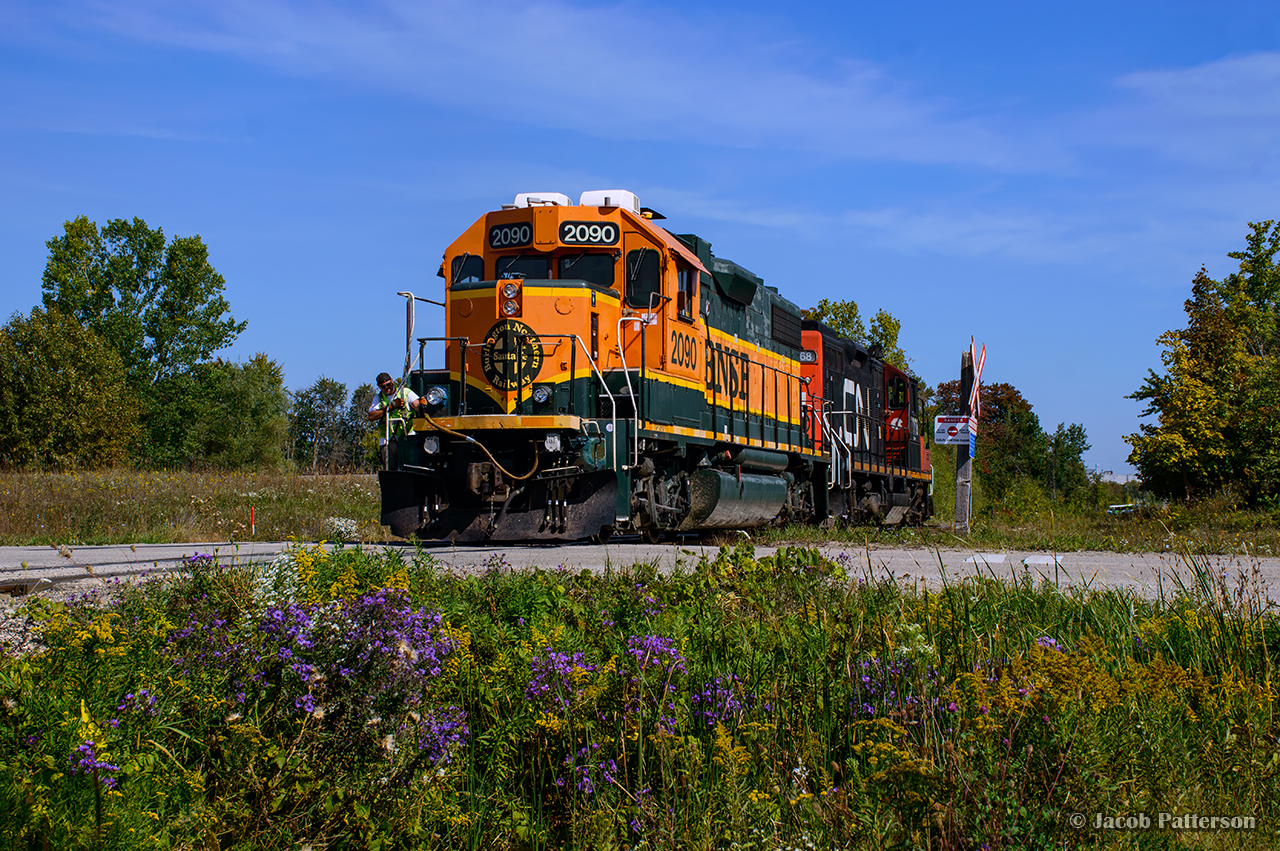 Shortly after 4 axle BNSF units arrived on CN rails to repay horse power hours, a few were assigned to the Toronto pool and dispatched to the local terminals.    Working out of Kitchener, BNSF 2090 is paired with CN 7068 while switching customers around Guelph.