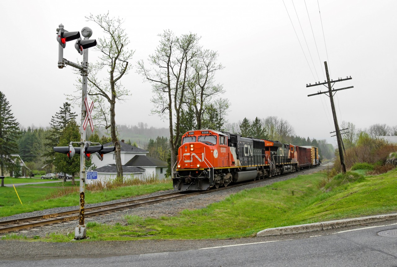 Fresh SD75IACC #8308 leads a very short train 562 in the small town of Saint-Noel, as it heads to Campbellton where hopefully they will take a longer train down to Mont-Joli. The weather that day wasn't perfect, being very foggy, but the power made it worth the trip. I also could hear the old crossing bell's one last time before they replaced it moments later, CN are saddly replacing them with electronic ones regardless if they are in working condition or not.