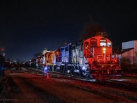 Its half past midnight at Kitchener yard.  The last GO trains of the evening have cleared the area, and freight action is well underway.  L566 slipped out to the Waterloo Spur behind 4906, 7068 shortly before this scene, rushing to clear up and give L533 access to the yard, while L587 with 4125, 4902, and HESR 3510 sat on the ladder.

<br><br>With 533 in the siding and their engineer changing ends, 587 tacks the 3510 onto 533's power for movement to G&W's RailSynergy Oshawa operation, then ducks back into the yard to allow the Toronto crew to shove clear of the plant and make their runaround move to the east end of their lift.  587 will begin breaking up the inbound cars as soon as they've cleared the lead.