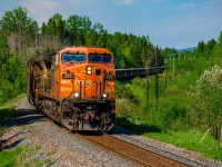 AC44CW #420 leads a loaded Bloom Lake ore train at Milepost 9 of the Wacouna Subdivision, it will interchange with the Arnaud railway just south of here, at Arnaud Jonction. With all the QNSL Dash 9s now retired and the SD40-3s being on switching and wayfreight duties, the AC44CWs such as this one are now the oldest active mainline power on the railway.