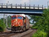 Running later than usual (and so well lit here for once), autorack train CN 271 heads west.