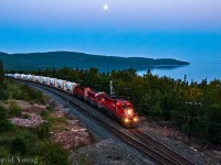 A follow up to <a href="https://www.railpictures.ca/?attachment_id=84">my one of my earliest uploads.</a> Around 2010-11 timeline CP was contracted to haul windmill towers and components from southern Ontario (Windsor, if memory serves correct?) to Alberta. This days edition was symbolled "785" and had a one of two type loco for the railroad along for the ride. The crew is roughly 10 miles into their trip over the Nipigon Sub about to hit the switch pionts of Selim West as the blue hour is setting in. CP 5912 West with sister SD40-2 6079 sandwiches the testbed Genset 3GS21B-DE 2101 sandwiched admist the trio. A decade and a half later, the siding at Selim has been extended west to a capacity of roughly 14,000', up from the previous capacity of roughly 8140'. 