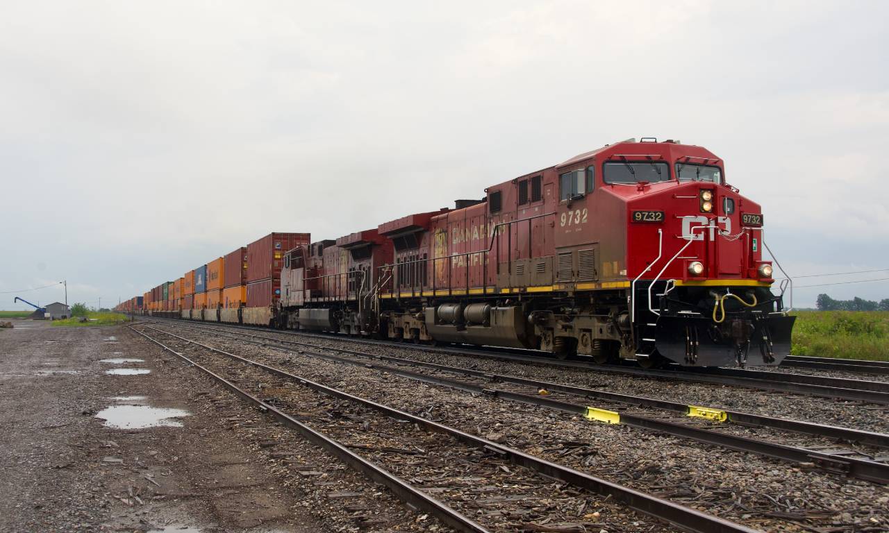 CP 9732 has a mixed up paint scheme as it leads CPKC 133,  with CP 9728 trailing.