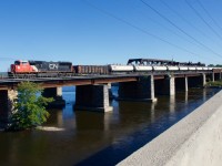 CN 709 leaves the island of Montreal with a scrap gon as a buffer car.