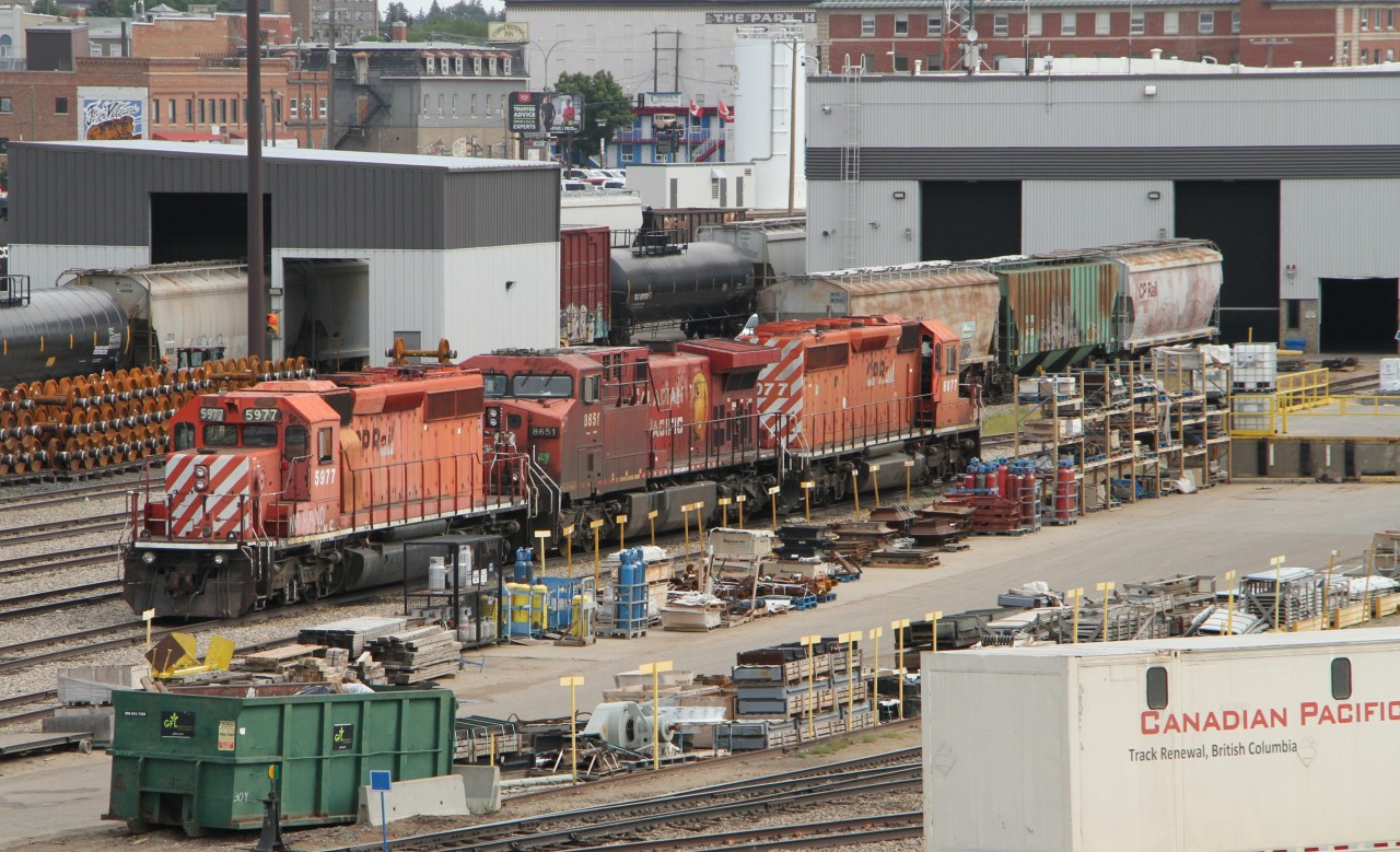 The Moose Jaw repair yard was a busy place on Tuesday August 11th. 5977 (EMD SD40-2), 8651 (GMP GP9) and 6077 (EMD SD40-2) are seen sitting in the yard waiting to be put back to work.