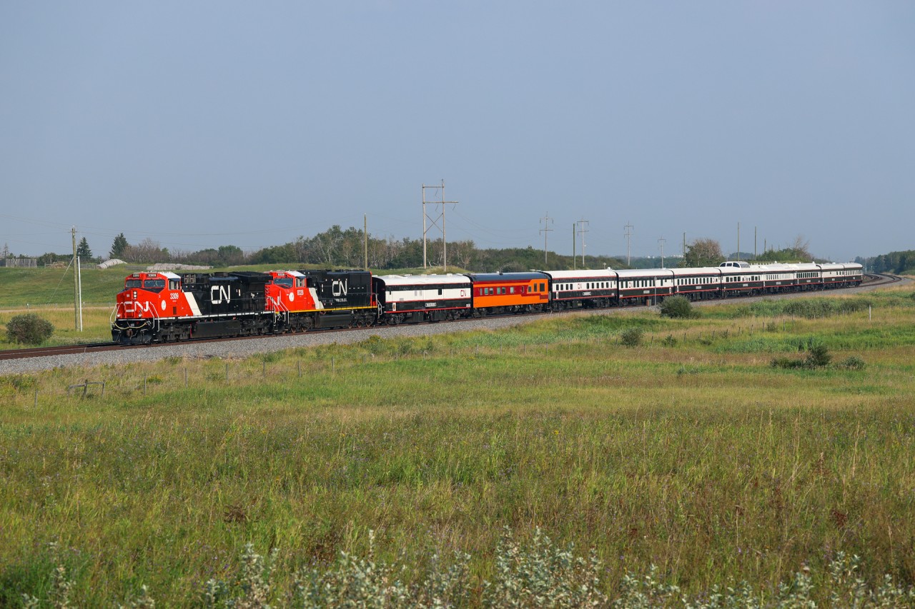 Chicago to Jasper deadhead move P 06791 21 approaches Kirby on the Wainwright Sub with CN 3309, 8328 and 10 coaches. 

For a video of this train click the YouTube link.  https://youtu.be/zH27G_tUujM?si=IsYpBLTyH_UgZxgn