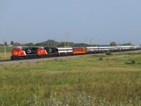 Chicago to Jasper deadhead move P 06791 21 approaches Kirby on the Wainwright Sub with CN 3309, 8328 and 10 coaches. 

For a video of this train click the YouTube link. <a href="https://youtu.be/zH27G_tUujM?si=IsYpBLTyH_UgZxgn"> https://youtu.be/zH27G_tUujM?si=IsYpBLTyH_UgZxgn </a>
