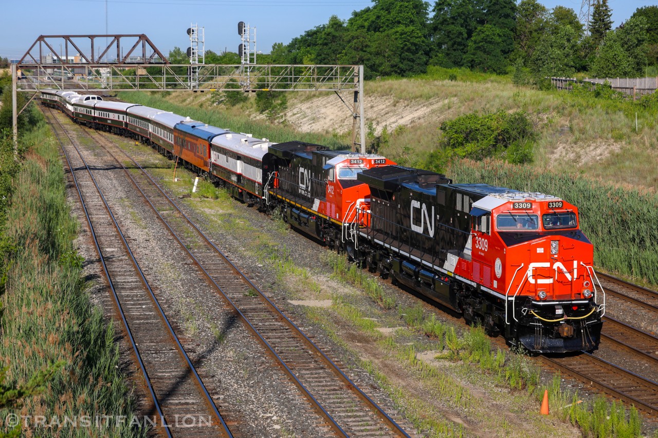 CN Office Car Special P00731 20 with CN 3309 and 3412 for power, deadheading to Oshawa yard this morning in preparation of the Niagara wine tasting excursion later. (2026/07/20)