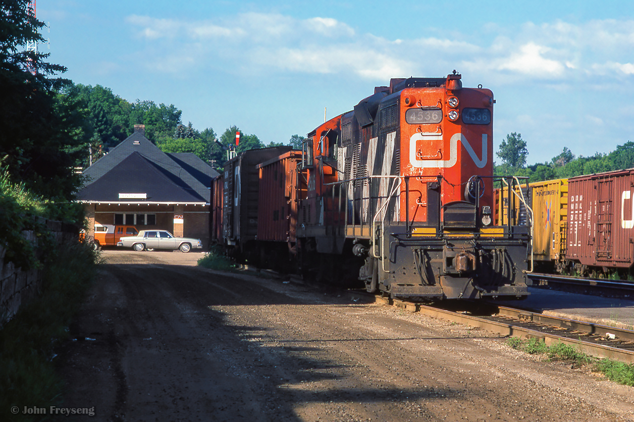 CN 4536 waits for the crew to climb aboard on a summer morning.  Shortly they will head to the south end of the yard.

Scan and editing by Jacob Patterson.