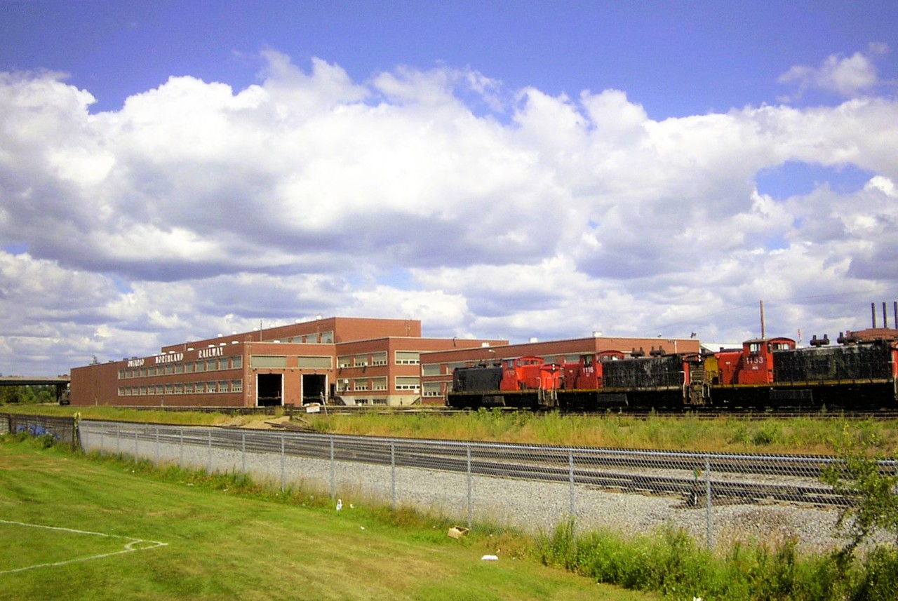 CNR at ONR  
25 years ago today, a trio of ex-CN GMD1's CN 1170, CN 1116, and CN 1153 are lined up outside the open doors of ONR's North Bay diesel shop. 
Two of the three GMD1's were stenciled INCO under the running number on the cab sides.