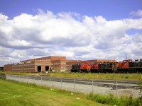 <b> CNR at ONR </b> <br>
25 years ago today, a trio of ex-CN GMD1's CN 1170, CN 1116, and CN 1153 are lined up outside the open doors of ONR's North Bay diesel shop. <br>
Two of the three GMD1's were stenciled INCO under the running number on the cab sides.