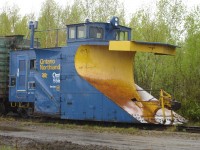 <b> Rainy day plow </b> <br>
Single track snowplow ONT 555 sits in the rain on a deadline at North Bay, ON May 19, 2009.