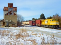 CP Train 420 passing the grain elevator at Kleinburg on the Mactier Subdicision on a cool winter's day in 2021.<br><br>
Back in 2021 a couple of these yellow demonstrators led on the mainline on CP - and in 2019/2020 a different set were testing on CN. It looks like it's paid off, because <a href=https://www.trainorders.com/discussion/read.php?1,6129345 target=_blank>CPKC has decided to order 65 similar units</a>. These won't be the same as the demonstrators pictured here, <a hreff=https://www.trains.com/pro/mechanical/locomotives/cpkc-orders-65-new-emd-sd70ace-t4-locomotives-from-progress-rail/ target=_blank>they will have  modifications designed after feedback from demonstration runs</a> including a new energy management system with a 5-7% fuel savings over prior Tier 4 units, and Talos Energy Management system amongst other improvements. In effect, I would say these would be a "dash two" of the SD70ACE-T4 series but Progress seems to have declined to call them anything but what they've always been referred to, which to me is strange. What do you think of the SD70ACE name for these Tier 4's? Comment below. As for the fate of these demonstrators, 7210 is now with Lake State Railway along with 7209, 7211 and 7212. A gaggle of earlier Tier 4 demonstrators from the 2019/2020/2021 era have also been recently scrapped after stints in mexico and elsewhere. Could a CN order be next? There's four demonstrators on CN right now.