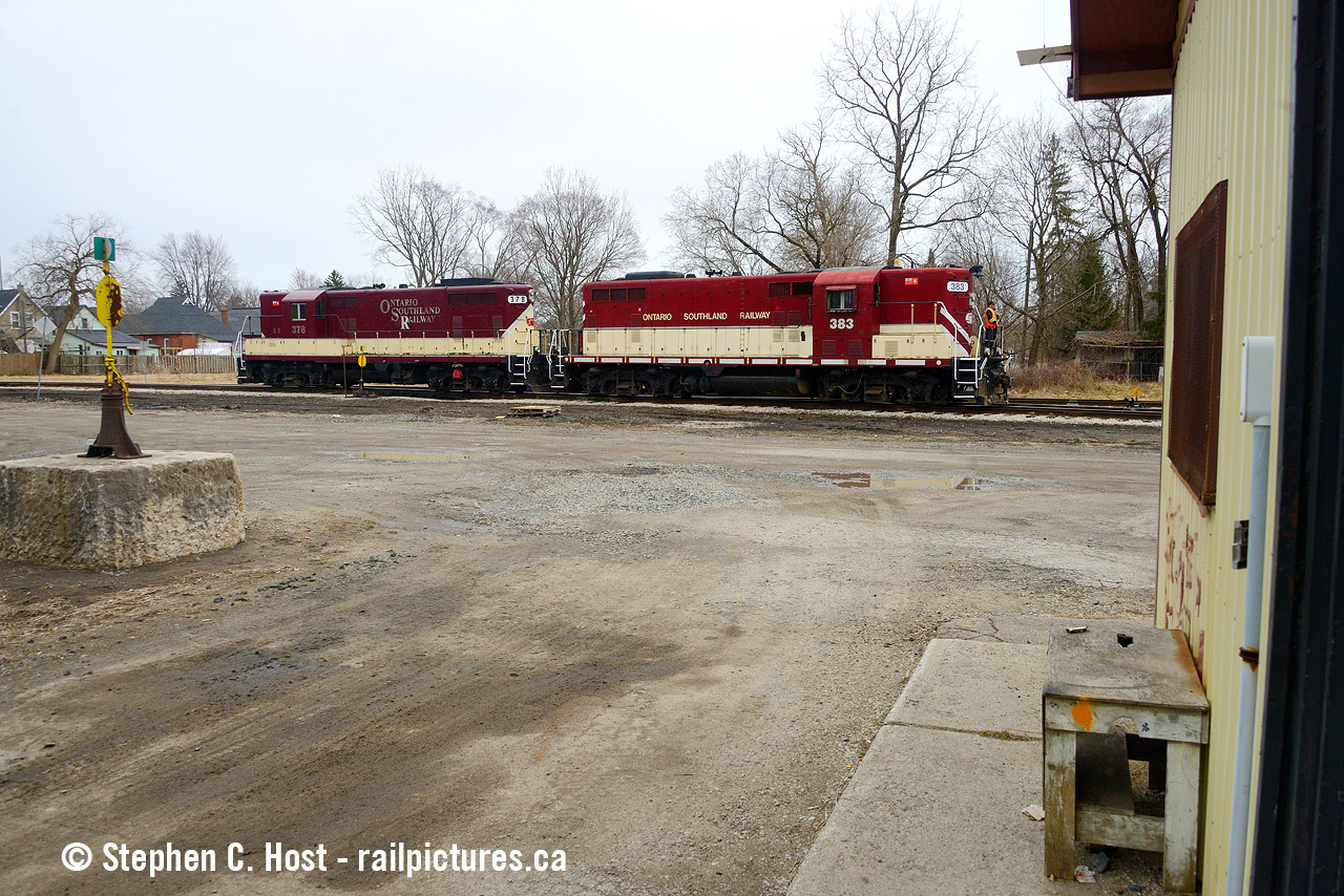 A pair of OSR GP7's are switching in St. Thomas yard and I framed them between the CN yard office and the interesting decorations found on the property. Since this photo was taken, the CN yard offices have all been razed and removed.