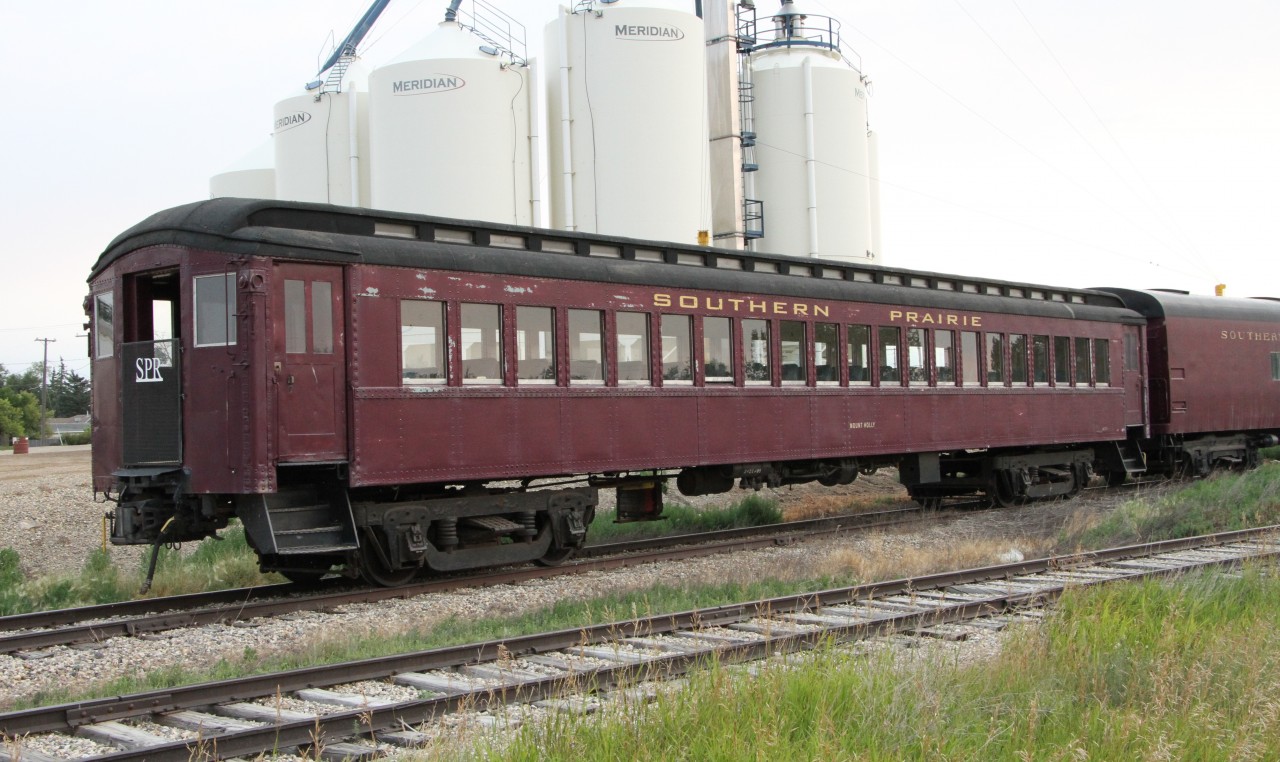 Southern Prarie Railroad is located in Ogema Saskatchewan and the day I was passing through,this car along with a baggage car and a caboose they were restoring were sitting on a small siding. I know nothing about the passenger car except if has the name Mount Holly on it. If anyone can give more info I would be grateful.