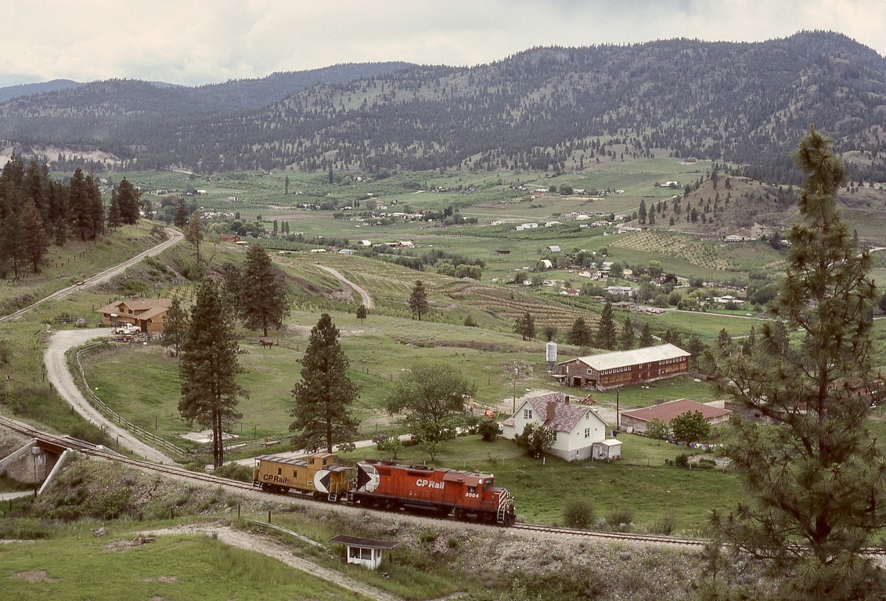 Current news reports of wildfire damage in the Summerland to Faulder area reminded me of many years ago with mid-week days off work and able to photograph operations on the CP Princeton sub., with West Summerland a definite favourite location.  The daily Penticton to Princeton wayfreight, usually a caboose hop but occasionally with leftover westward tonnage, was quite predictable for timing, such as on Tuesday 1984-06-12 passing along Prairie Valley after a bridge over Fyffe Road while returning to Penticton.

Happily, the Kettle Valley Steam Railway, which operates over this track, has  escaped fire damage.