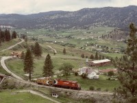 Current news reports of wildfire damage in the Summerland to Faulder area reminded me of many years ago with mid-week days off work and able to photograph operations on the CP Princeton sub., with West Summerland a definite favourite location.  The daily Penticton to Princeton wayfreight, usually a caboose hop but occasionally with leftover westward tonnage, was quite predictable for timing, such as on Tuesday 1984-06-12 passing along Prairie Valley after a bridge over Fyffe Road while returning to Penticton.

<p>Happily, the Kettle Valley Steam Railway, which operates over this track, has  escaped fire damage.