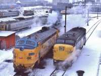 <br>
<br>
Something for every Fan...
<br>
<br>
Upper left, in front of the John Street TTR tower, a  string of VIA equipment including blue CC&F coaches, LRC loco and assorted Budd Cars
<br>
<br>
Upper centre: assorted Budd Cars, MLW 1960 built RS-18m CN 315x modified for Tempo service (and appears to be dead storage – by this time VIA had sold most Tempo equipment ( HEP equipment !) to the D&RGW for their Ski Train) and a  LRC loco, 
<br>
<br>
And front of  the above: for use at public events: the CN Safety Caboose (HEP equipped, ha ! )
<br>
<br>
The foreground:
<br>
<br>
GMD 1953 built FP7A: ONR 1520 and sister, one of 22 original deliveries, 1520 scrapped 2005/ 
<br>
<br>
MLW 1958 built FPA-4  ex CN VIA 6765, retired by 1989
<br>
<br>
GMD 1957 built FP9A ex CN  VIA 6526, the future 6313 then to Ohio Central April 2002
<br>
<br>
At CN Spadina, January 15, 1983 Kodachrome by S.Danko
<br>
<br>
also: just above the  RS-18m is the CN loop track, connecting at Spadina Ave. Mileage 0.69 Oakville Sub., that circled the roundhouse for turning consists.
<br>
<br>
sdfourty