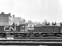 It is somewhen between 1969 and 1972 in Toronto where CN 7029 and CN 8138 are sitting in the CN Spadina yard.