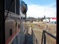 Here's the long-hood forward view while riding aboard Orangeville-Brampton Railway's <a href=https://www.railpictures.ca/?attachment_id=59877><b>CCGX 1000</b></a>, a 1957 GMD-built GP9, as it runs around Orangeville Yard after completing its twice-weekly run to Streetsville and back. After dropping its lone car off in the yard, it was then filled up by local fuel dealer Bryan's Fuel and received some some <a href=https://www.railpictures.ca/?attachment_id=58339><b>light servicing</b></a> from the engineer and conductor. Then the unit was moved around the yard and onto the station track to tie down on the <a href=http://www.railpictures.ca/?attachment_id=9134><b>Credit Valley Explorer's</b></a> passenger equipment, effectively being put away for the day. In the distance is the OBRY's <a href=http://www.railpictures.ca/?attachment_id=415><b>new Orangeville Station</b></a>, and on the right is the site of the <a href=http://www.railpictures.ca/?attachment_id=18795><b>former CPR bunkhouse</b></a> that burned down a few years prior. Another big thanks to Conductor Steve and Engineer Wayne for the short cab ride.<br><br>The GP9 was designed to be a bidirectional roadswitcher locomotive, but still had controls installed oriented for one end to lead or be designated the "front" of the unit. Dating from steam era practices, many railroads in the 1940's and 50's ordered their new diesel locomotives oriented for long-hood forward operation, putting the diesel engine and main generator in front of the crew and cab. One reason was for better accident protection in the event of a level crossing or head-on collision, another was crew familiarity after operating steam engines like this for so long. This practice gradually switched during the 50's and 60's as locomotives with <a href=http://www.railpictures.ca/?attachment_id=37417><b>low short hoods</b></a> and better visibility became more popular. <br><br><a href=http://www.railpictures.ca/?attachment_id=8265><b>Quebec, North Shore and Labrador</b></a>, <a href=https://www.railpictures.ca/?attachment_id=9671><b>Ontario Northland</b></a>, and <a href=http://www.railpictures.ca/?attachment_id=38957><b>Canadian Pacific</b></a> all ordered their Canadian-built GP7/GP9 units oriented for short hood forward operation, but <a href=http://www.railpictures.ca/?attachment_id=43271><b>Canadian National</b></a> purchased their entire fleet as long-hood forward units. While on 1000 this is the conductor's view looking out the back, on a CN unit this would have been the engineer's view looking forward for many decades operating a GP7/GP9, RS3/10/18 and other first generation diesels on mainline freights (even today, the 7000's and 7200's still have the controls oriented for long-hood forward operation).