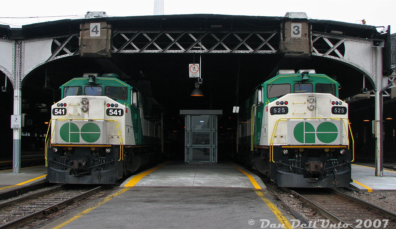 Who can resist a nice pair of GO Transit F59PH units just sticking out of the Toronto Union Station train shed, ripe for a photo? GO 541 on Georgetown line train #210 was our morning ride into the city, shown unloading on Track 4 next to 525 on an unknown morning train that's just about to back out of the train shed on Track 3. Despite the signs, there was no trouble as long as one didn't linger and was a paying customer (just don't cross the tracks, they hate that). There were, of course, other ways to shoot F59's under the train shed.

I believe 525 and the first order (520-535) were rebuilt at AMF in Montreal, which was why they received those CN font numberboards, while 541 was a later rebuild done at CAD or CLN and got that larger font style. 525 is now pushing Dallas area commuters around Texas as Trinity Railway Express 120, while 541 is doing the same in North Carolina as NC DOT control cab 102.