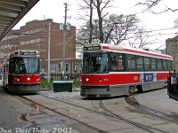 A normal everyday scene at Bathurst Subway Station for many years, but not to be repeated again with CLRV streetcars today: TTC 4188 on a northbound 511 Bathurst run arrives into the station's streetcar loop, meeting sister car 4174 laying over between runs down to Union on the station's pocket track. Sand is in abundance here from the green bin, if a car is running low. Both cars were retired in 2017 after 36 years in service.