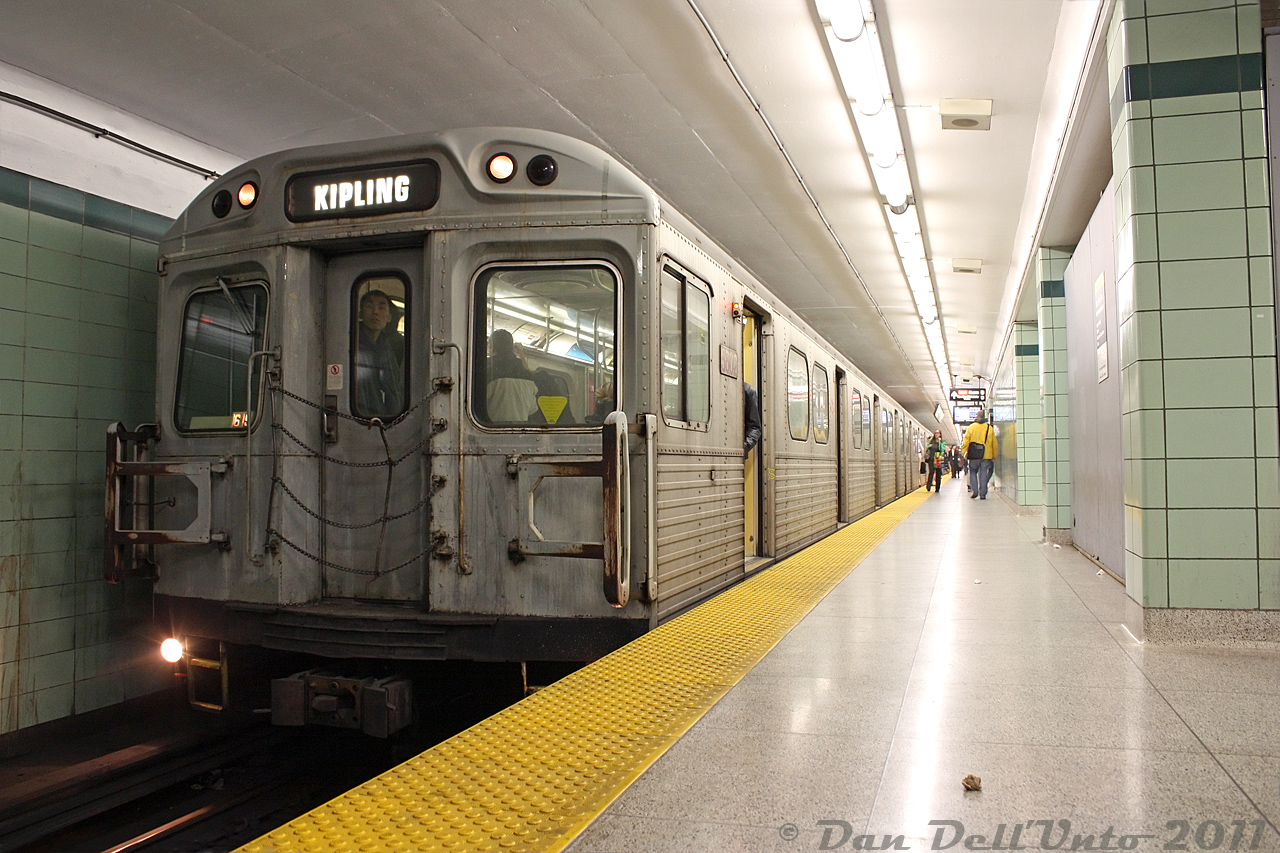 An H4 in the wild, in its natural habitat on the Bloor-Danforth subway line. Minutes before a brand new Toronto Rocket (TR) set in testing service rolled into the station upstairs, the oldest relics of the subway line were still hauling passengers below. TTC H4 5602 leads a 6-pack of the 1970's Hawker Siddeley cars westbound, pausing at St. George Subway Station just before 10pm on the way west to Kipling Station.The new TR cars spelled the end of the entire H4 fleet by January 2012, pushed out by Yonge-University-Spadina line T1's transferred to the B-D line. The H5 and H6 fleets were also retired as deliveries continued.