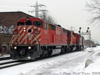 One CP Red Barn is nice, two is a treat, and an SD40-2 between is the cherry on top! CP SD40-2F units 9012 and 9022 bracket SD40-2 5746 on a very short train #223, running as light power from Toronto Yard to the Vaughan Intermodal Terminal to lift their train. The units are seen here about to cross Bartlett Avenue, heading westbound along CP's North Toronto Sub after <a href=https://www.railpictures.ca/?attachment_id=59511><b>CP #137 with a pair of SD40-2 units</b></a> passed by. And earlier, CP transfer #T56 showed up with the <a href=https://www.railpictures.ca/?attachment_id=59561><b>ratty ex-Guilford 4652</b></a> leading.<br><br>When the great Red Barn fleet fell, CP 9012 was sold to J&L Consulting for scrap in late 2016, but 9022 (one of only two repainted in the dual flags "System" livery) found its way back to CP after a stint operating on the Central Maine & Quebec Ry with a few other lucky SD40-2F survivors. 5746 was sold to K&K Recycling to become soup cans and new Hondas in 2017.